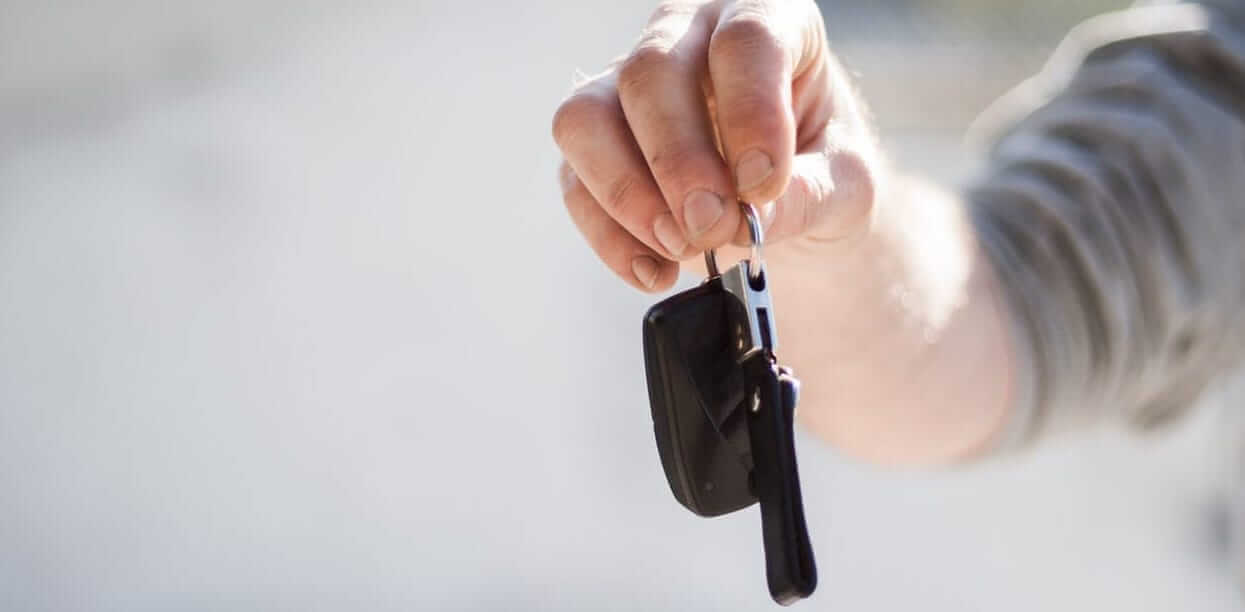hand holding car keys