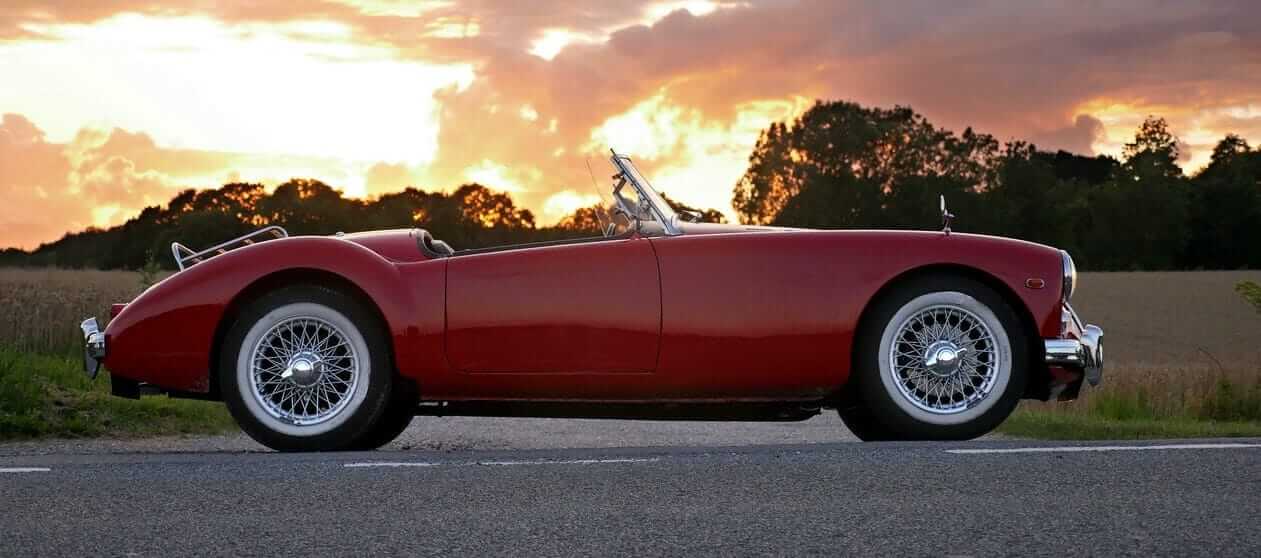 red car with sunset background